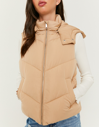 beige sleeveless puffer jacket