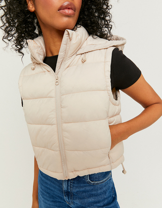 beige sleeveless puffer jacket
