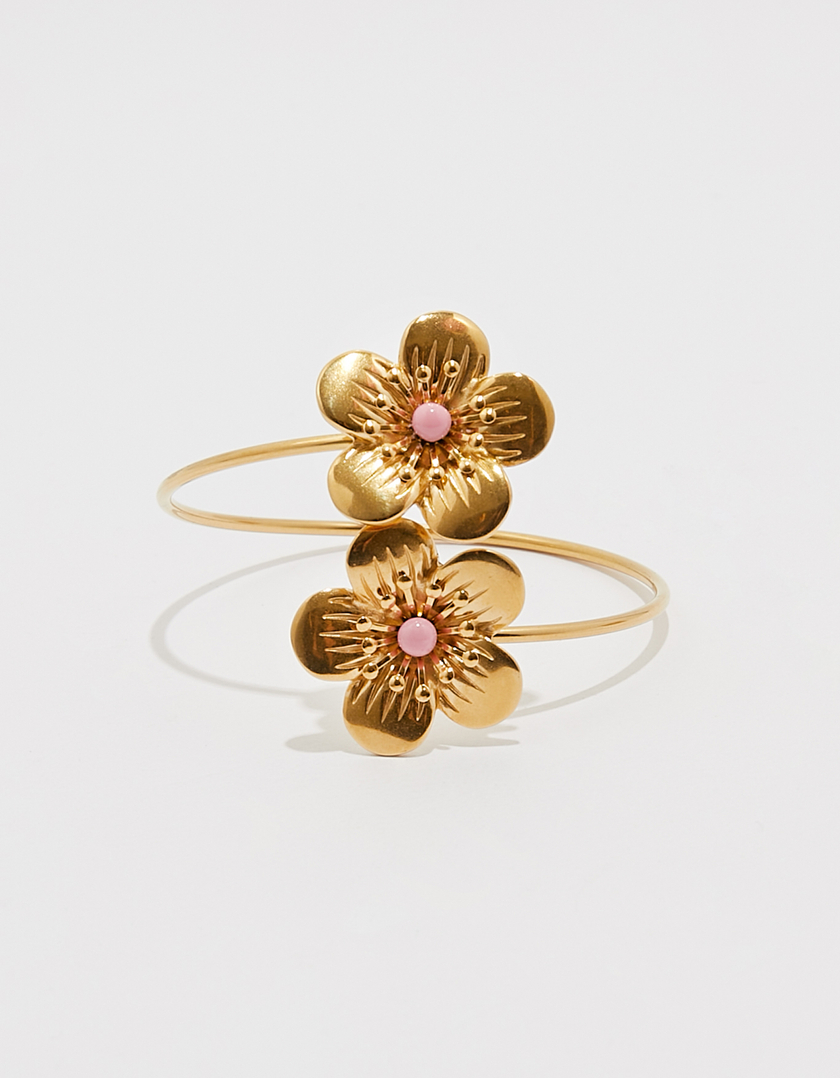 Bracciale rigido dorato con fiori